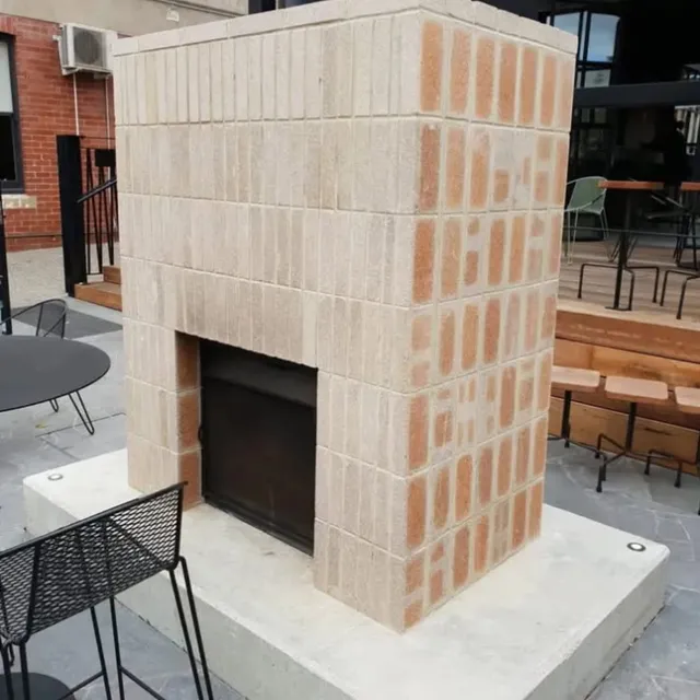 Bespoke brick fireplace with soldier-course detailing at The Arborist, Geelong